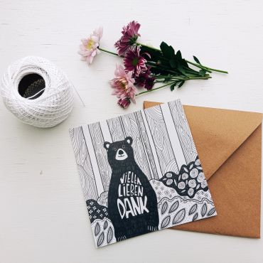 Artistic thank you card with flowers and string.