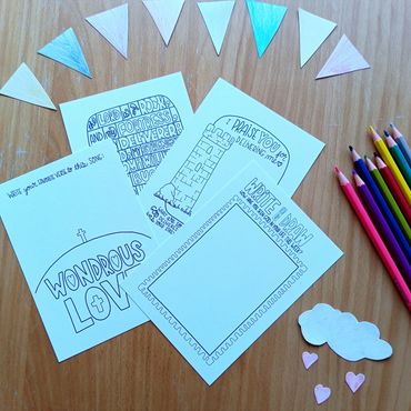 Coloring cards with inspirational messages and colored pencils.