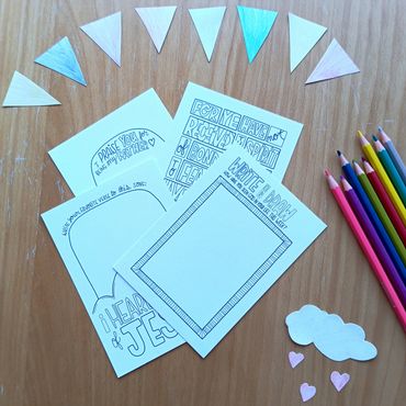 Coloring pages and pencils for kids crafting.