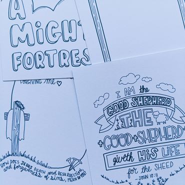 Hand-drawn religious-themed posters with scripture and illustrations.