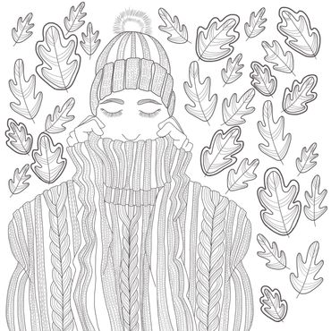 Person wrapped in cozy knitwear surrounded by autumn leaves.