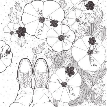 Top view of shoes among large flowers and leaves.