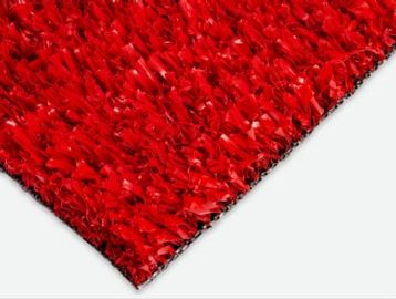 Close-up of a red textured carpet corner.