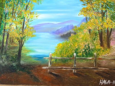 Serene lakeside view framed by autumn trees and a rustic wooden fence.