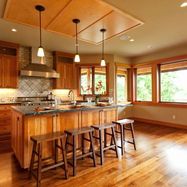 Warm wooden kitchen with island and stools.