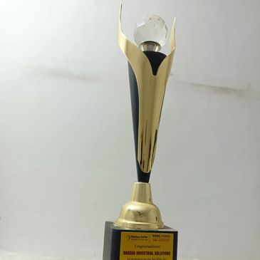 Elegant gold and black trophy with a clear ball top.