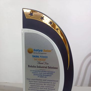 Award plaque recognizing Raksha Industrial Solutions by Satya Solar and Tata Power.