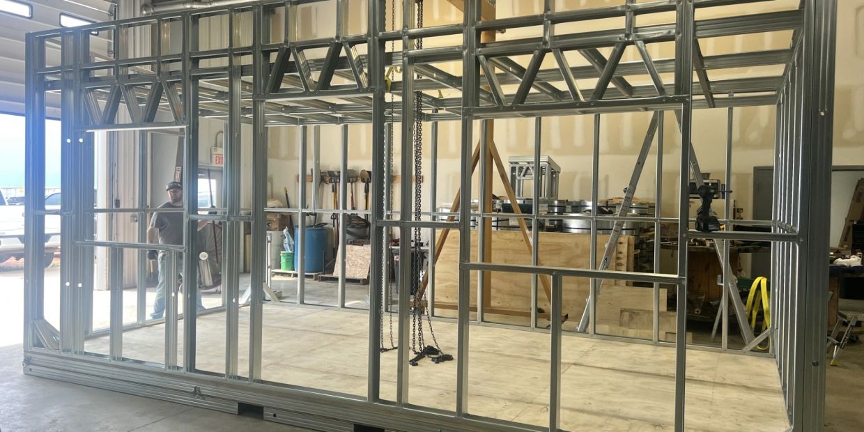 Metal frame structure for a building under construction.