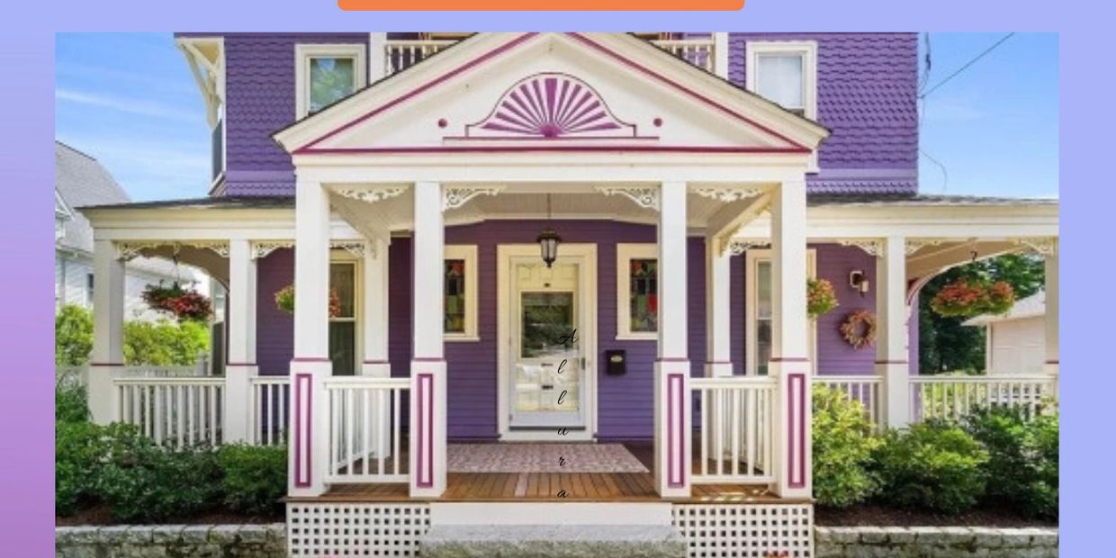 A charming purple Victorian house with white and pink accents and a welcoming porch.
