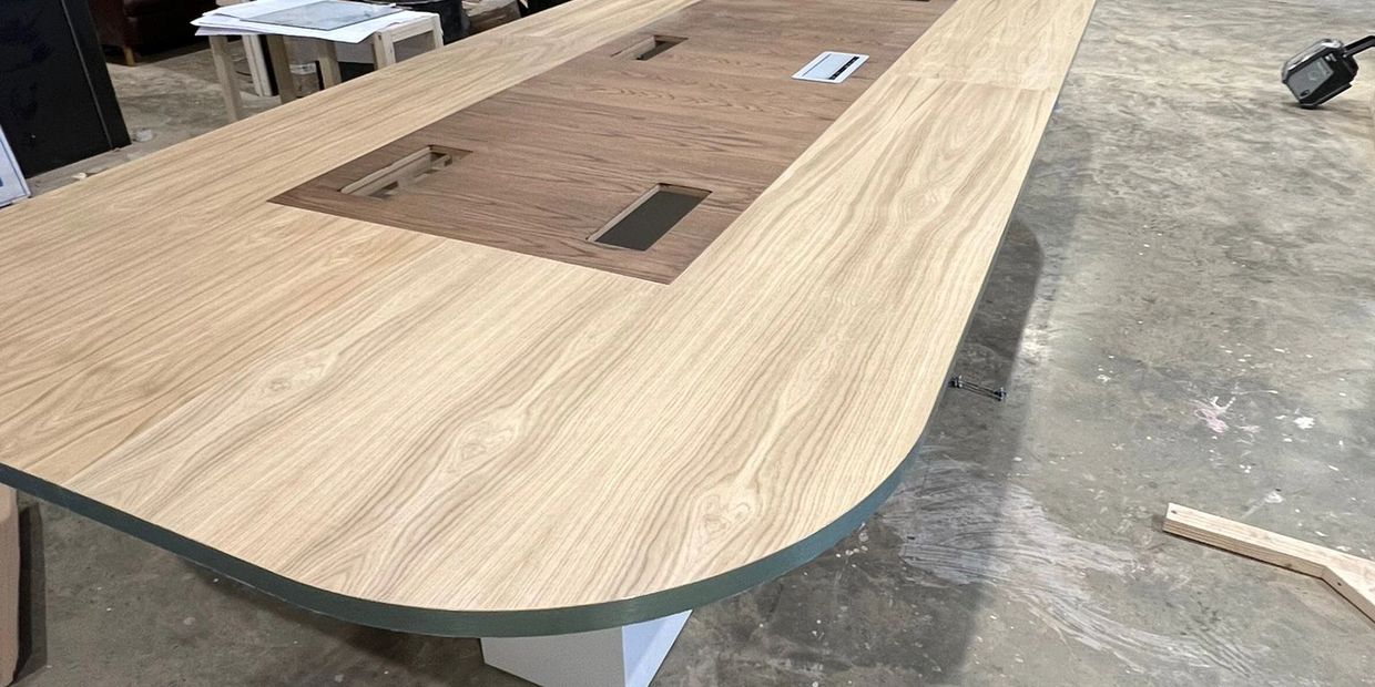 Large desk being manufactured for corporate meetings