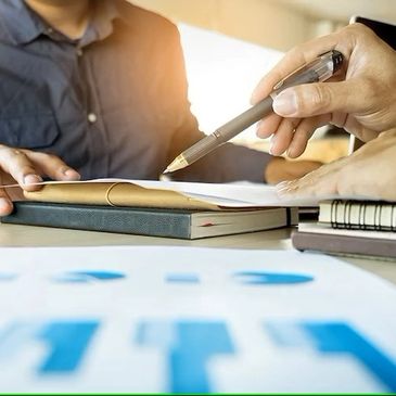 a person pointing out a point with a pen 