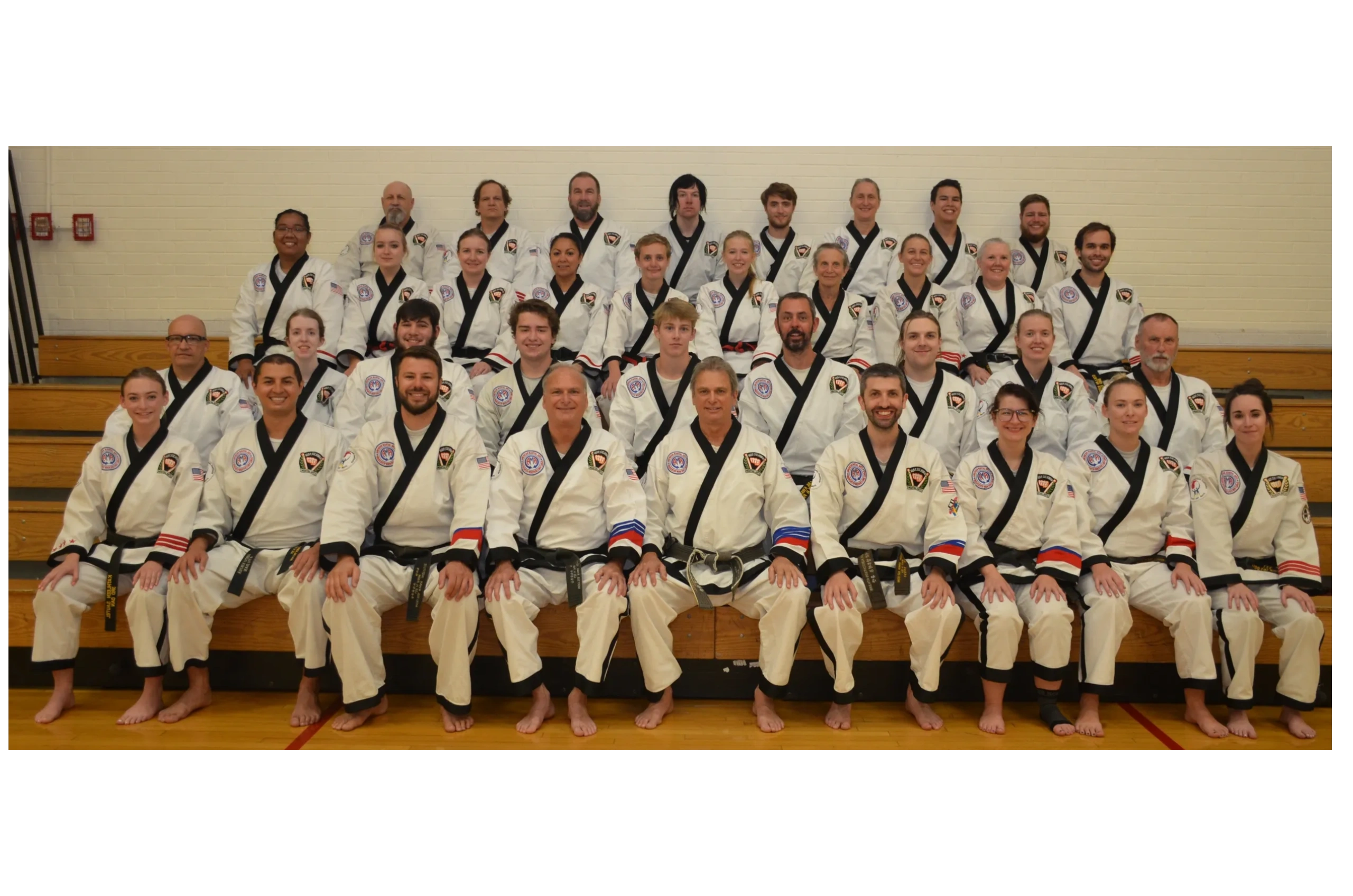 Adult Karate students taking a group photo after a Denver martial arts class.