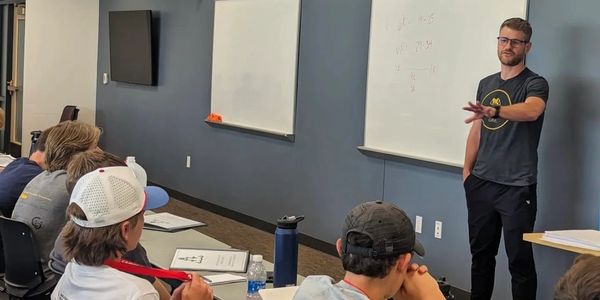 man presenting to teenagers