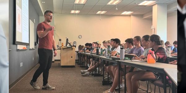 man presenting to class