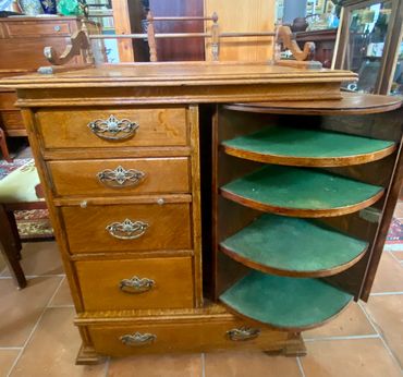 Unique oak barber’s cabinet