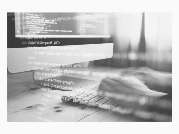 Someone creating code on a computer