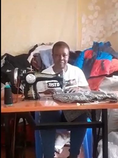 A Taylor sitting and weaving