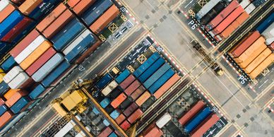 Aerial view of colorful shipping containers at a busy port.