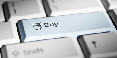 Keyboard key labeled 'Buy' with shopping cart icon.