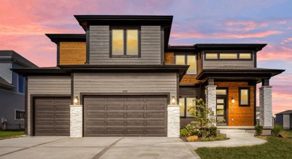 Modern two-story house with mixed wood and stone exterior 