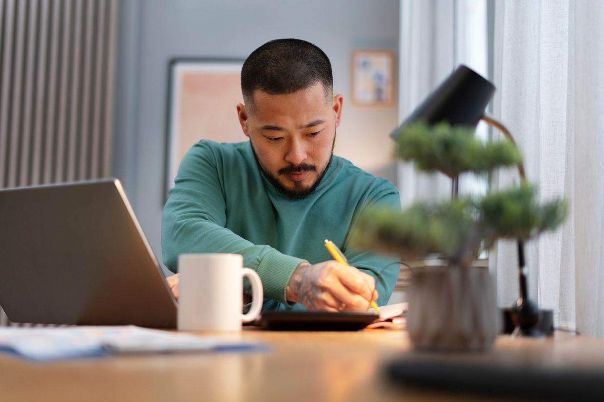 asian man working home mental health session online 