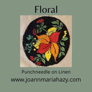Punchneedle - black backgrouns - circular design - red, yellow, orange flows with green leaves
