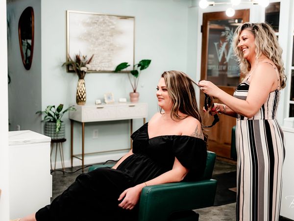 Woman getting her hair done in a salon.