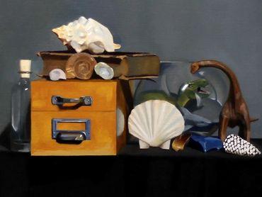 Framed still life painting with shells, books, and dinosaur figurines.