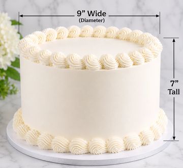 Simple round white cake with cream swirls on top and bottom.
