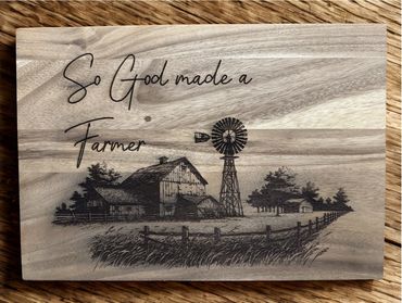 Wooden plaque with farm scene and quote about farmers.