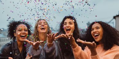 Four women celebrate as they embrace the magic of being wildly themselves.