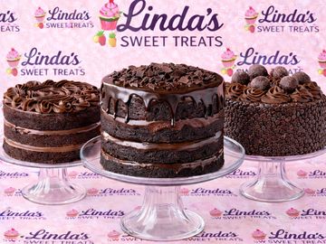 Three decadent chocolate cakes on glass stands with Linda's Sweet Treats branding.