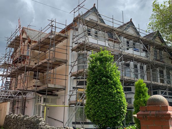 Extended scaffolding providing platforms for ongoing work on a new apartment block