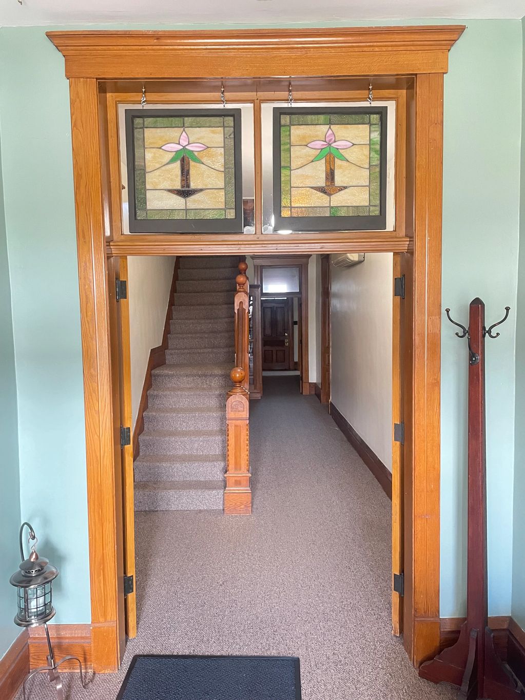 Beautiful stained glass windows greet guests in the front foyer.