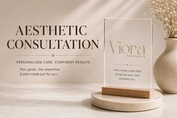 Aesthetic consultation promotion with a clear display stand and vase.