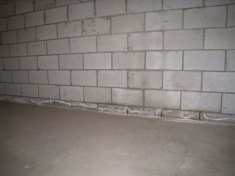 The advantage of Skim coating concrete or block walls.