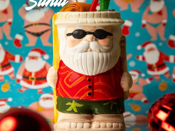 Holiday cocktail in Louisville with aged rum, citrus, gingerbread spice at Sippin’ Santa Whiskey Row