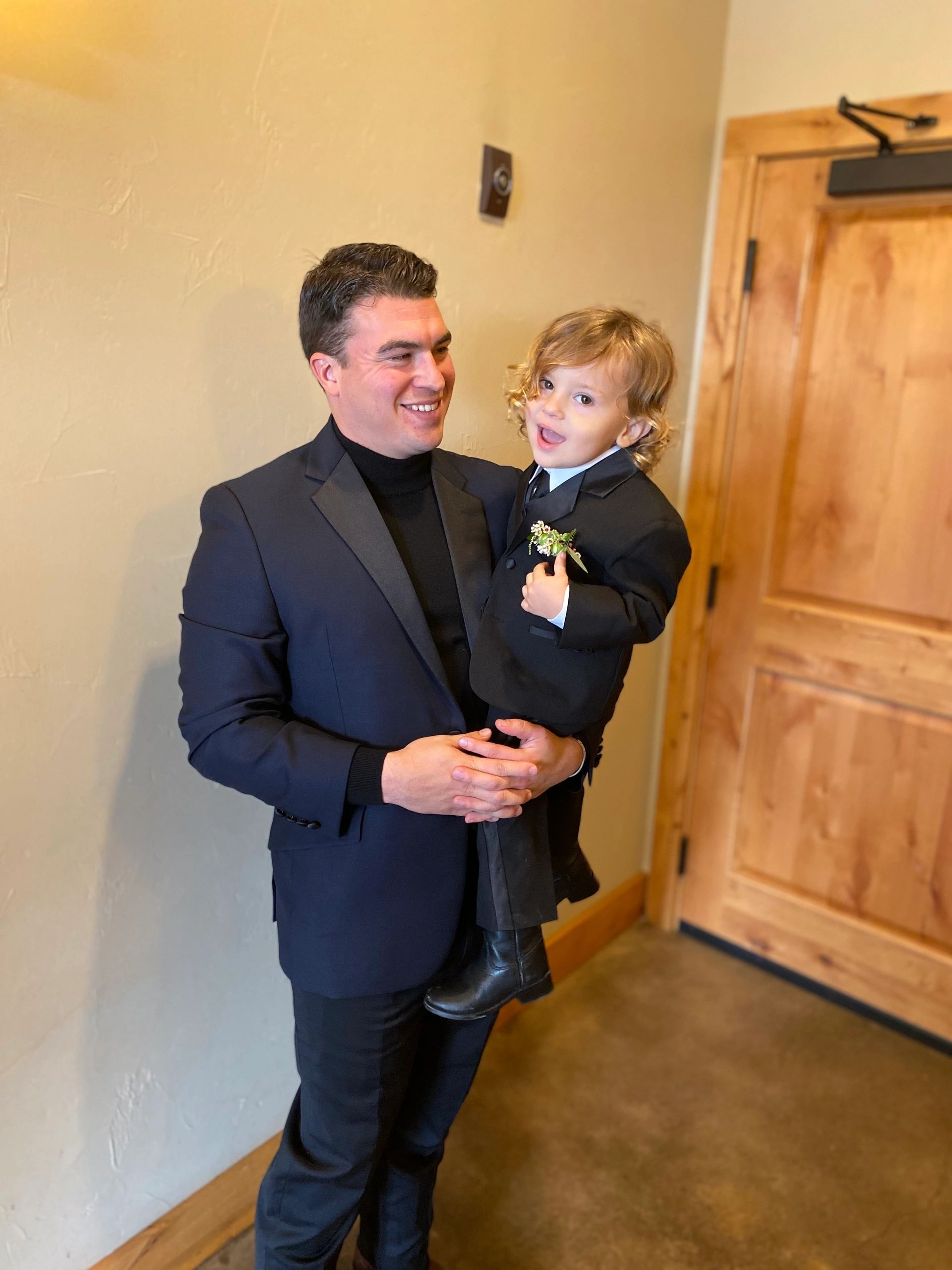Groom and groomsmen in BLU custom suits Houston