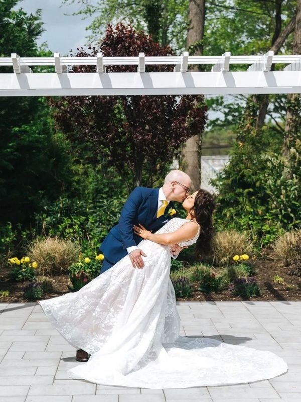 Couple kissing under pergola