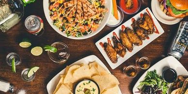 A table filled with various appetizers and drinks.
