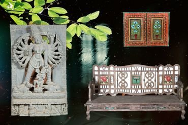 The antique Durga, the bench, the painted window all come together beautifully