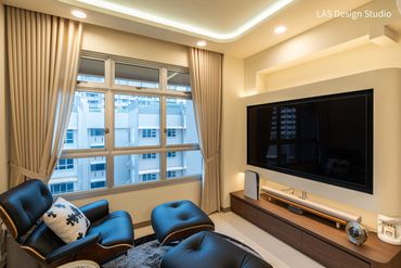 Cozy modern living room with leather lounge chair and wall-mounted TV.