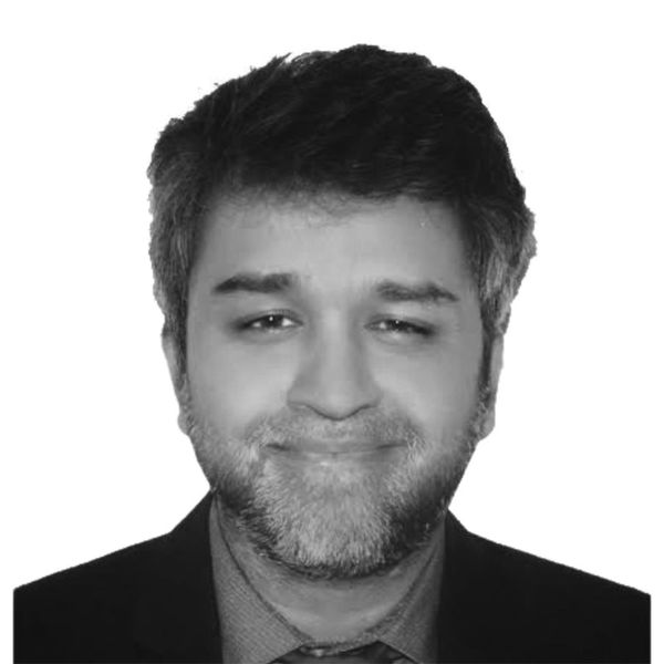 A black and white photo in a circular shape of Istiaque Doza.