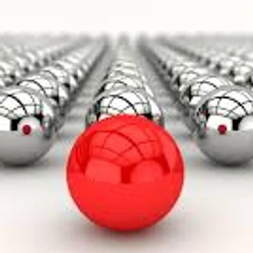 A Red Ball in a Group of Silver Balls