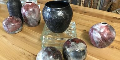 Multiple clay pieces of pottery.