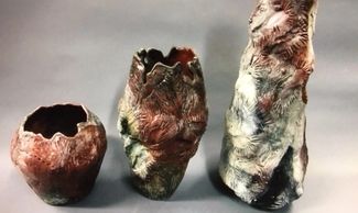 Three colorful pieces of pottery.