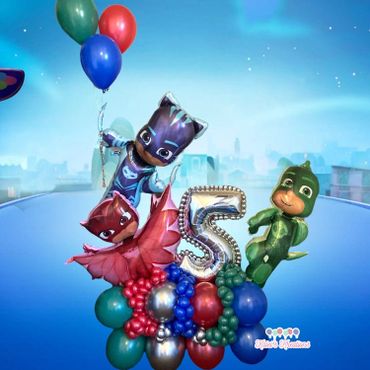Catboy, Owelette, and Gekko are all gathered around a large number 5 balloon.
