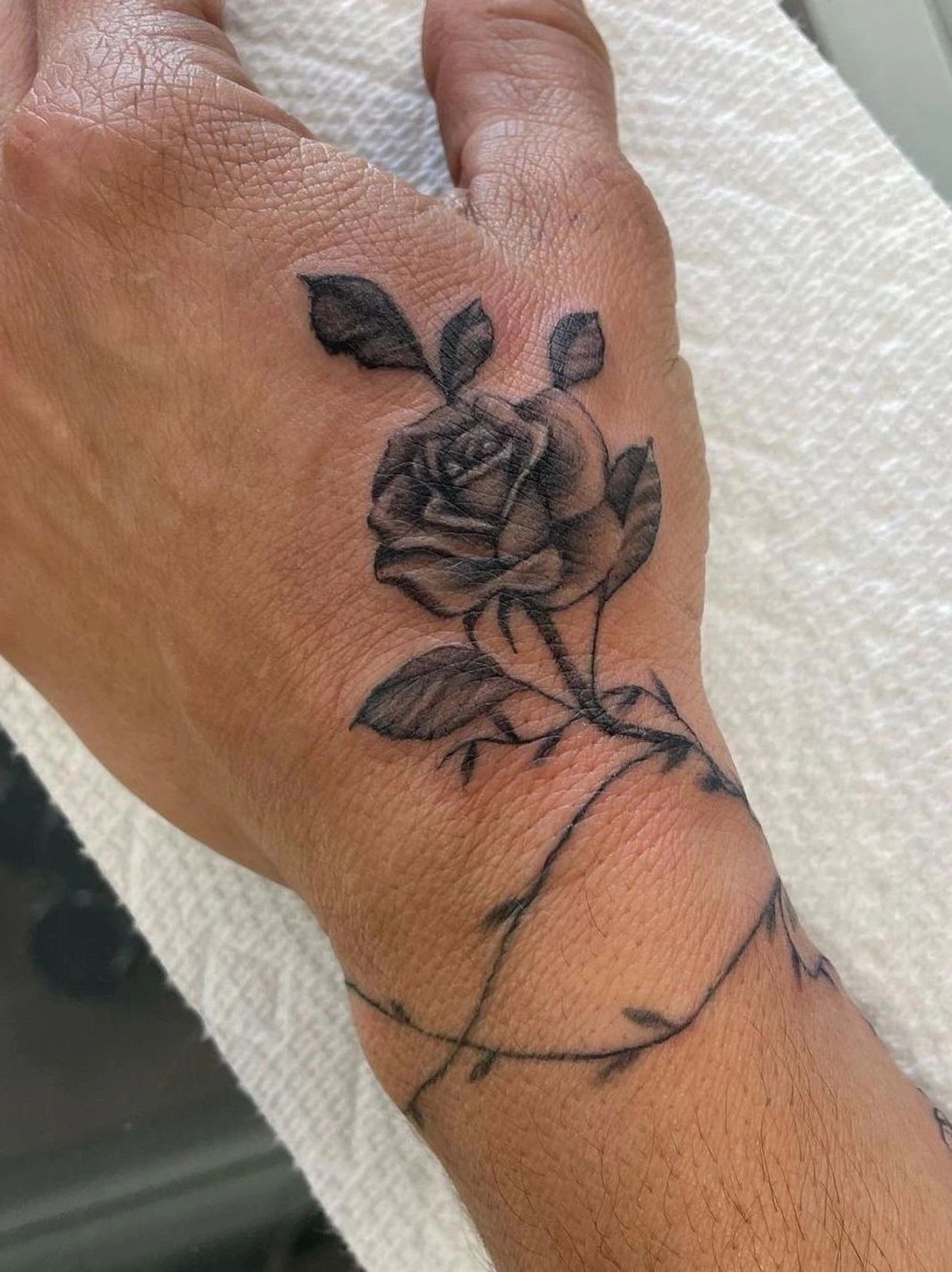 rose hand tattoo 