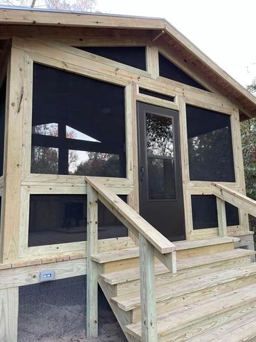 New construction with screened in living, wood burning stove, and ceiling fan.  