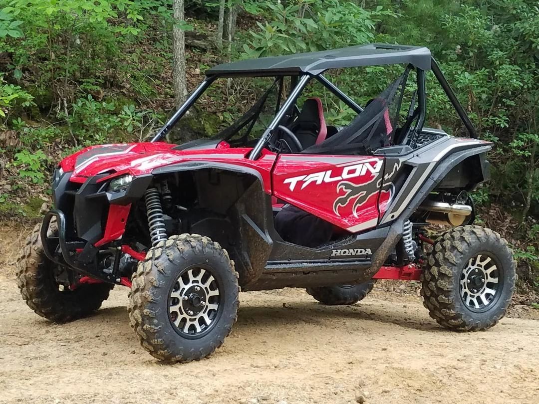 A red Talon ATV